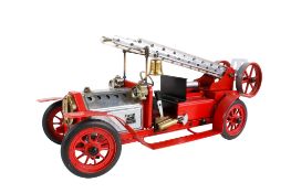 A Mamod live steam model fire engine. With a ladder and bell to the top, L45cm.