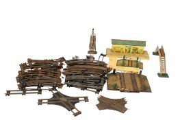 An assortment of Hornby 0 gauge tinplate buildings and layout accessories.