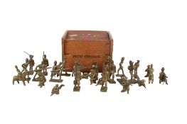 A collection of vintage brass soldiers.