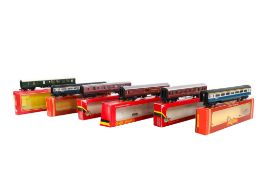 Six 00 gauge coaches and carriages. Including a Hornby R.