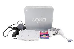 A Sony Playstation (PS One) Gaming Console.