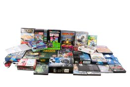 A collection of computer games cassettes, video games and accessories.