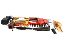 An assortment of Tri-ang 00 gauge locomotives, carriages and layout accessories.