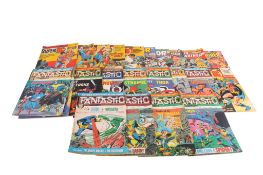 A collection of vintage reprint superhero comics.