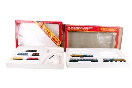 Two boxed sets of Hornby 00 gauge train sets.