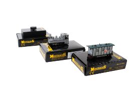 A Minitrains OO9/HOE gauge locomotive, van and controller.