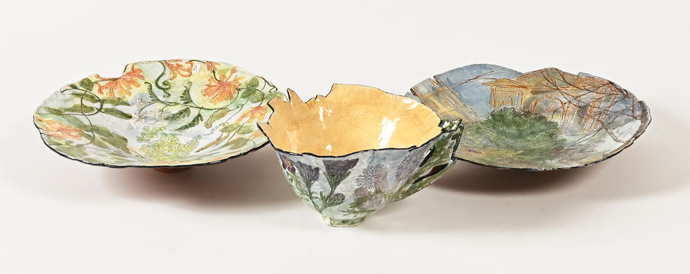 Claudia Clare (British born 1962), a teacup saucer and plate "The Goat and the Tea Merchant" from