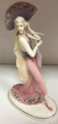 A Katzhutte pottery figure of a flapper dancer with fan bearing under-glazed mark to base and