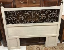 A painted and wrought iron double headboard in the Victorian taste 148cm high x 166.5cm width x 4.