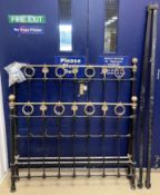 A Victorian iron and brass three quarter bedstead 131cm high x 127cm width
