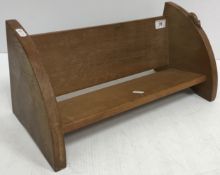 An oak book trough with carved mouse motif by Robert Thompson (The Mouseman) of Kilburn 45.