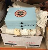 A box containing assorted table and bed linens to include crochet tablecloths, mats, etc.