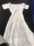 Two boxes containing two chemises, three Christening gowns and five baby dresses,