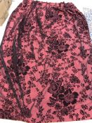 Two single shot silk with applied foliate flocking in black and red lined curtains with fixed