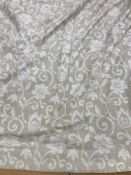 A pair of linen type foliate design by Jonelle in beige and cream lined curtains with taped pencil