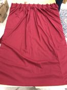 Two single wool interlined curtains in plain red with fixed triple pencil pleat headings,
