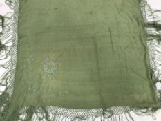 A brown leatherette suitcase containing an early 20th Century green silk shawl with embroidered