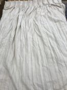 Two pairs and one single linen type cream with woven beige stripe loose lined curtains with fixed