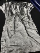 A box containing a number of jumpers including examples by Celine, Stella McCartney,