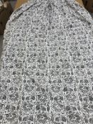 A pair of cotton blue and cream stylised flower decorated interlined curtains with fixed triple