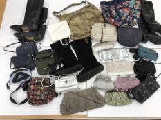 Two boxes containing three pairs of boots, size 5 (on two) and 7,