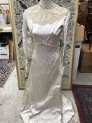 A 1950s oyster coloured duchesse satin wedding dress by Molly Stovell of Haywards Heath with