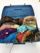 A blue Antler suitcase containing six mid 20th Century fur hats,