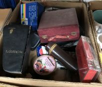 A box of assorted photographic equipment