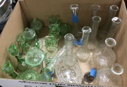A collection of glassware to include a uranium glass, candlesticks, stem vases,