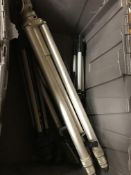 A box containing five assorted camera tripods