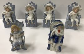A collection of German bisque-fired figurines,