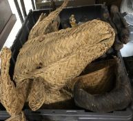A box containing various tribal masks and Indian decorations,