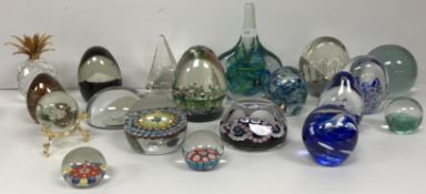 A box containing a collection of various paperweights including a Whitefriars Silver Jubilee