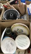 A box containing three modern Bundt tins, a Norwegian hegg cracker roller,