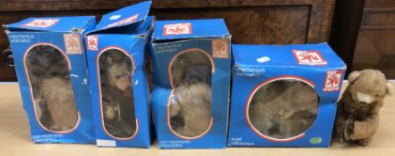 A collection of four Carl original plush and animated musician figures of bears and a similar dog