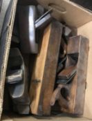 A box of antique smoothing planes, to include one stamped 