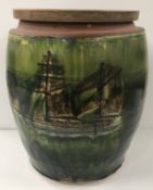 An early to mid 20th Century glazed terracotta crock of barrel form,