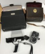 A Paillard Bolex C8 cine camera with leather case and a Bolex 150 Super cine camera with case