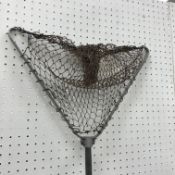 A set of painted iron scales with brass dishes and weights and a vintage folding landing net with