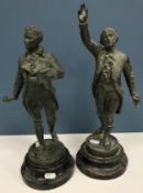 A pair of verdigris patinated bronze figures AFTER EUTROPE BOURET depicting men in 18th Century