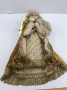 A painted and fabric covered puppet in the Venetian style,