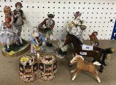 A collection of various Continental figurines including a Capodimonte figure in 18th Century dress