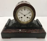A late 19th Century rosso and black marble cased French eight day mantel clock of drum style,