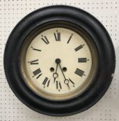 A late 19th Century French circular wall dial clock, the paper dial with Roman numerals,