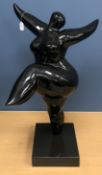 A modern black lacquered resin sculpture of a ballet dancer in the style of Niki de Saint Phalle on