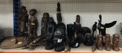 A Chinese carved hardwood figure of a bearded gentleman and a collection of various African carved