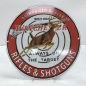 A modern reproduction enamelled circular sign inscribed 