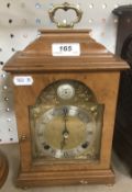 A 20th Century walnut cased mantel clock