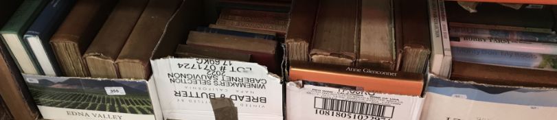 Four small boxes of various books to inc