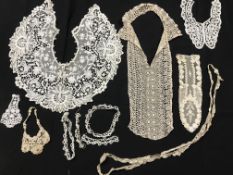 A collection of vintage lace collars, cuffs, jabots and other trims,